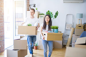 Couple moving in to their new home - Why Buy There Unless You Want To Live There?