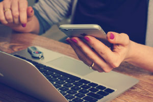 Woman checking mortgage online even with bad credit